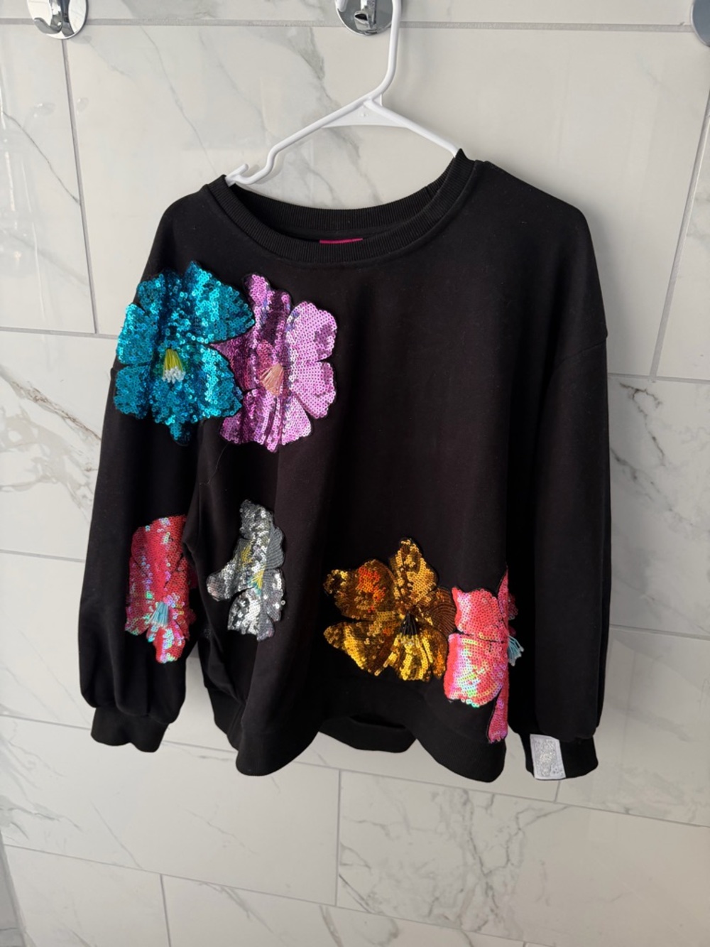 QUEEN OF SPARKLES Black Sweatshirt with Pink Sequin Floral Accent